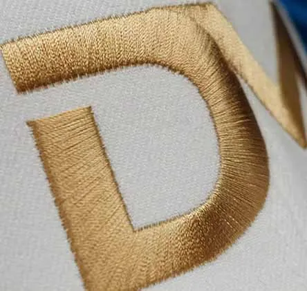 Custom embroidery machines stitching corporate and streetwear apparel