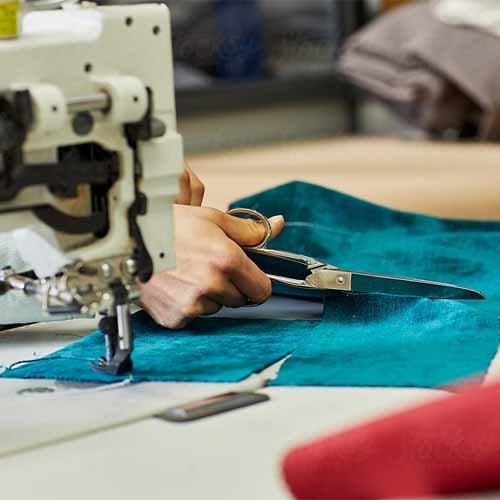 Modern automated cutting and sewing machine floor at Seam Apparel